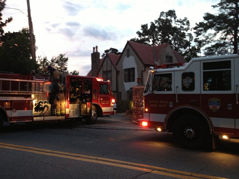 Fire crews respond Friday, Sept. 13, 2013, to a report of a fire on Lenon Place in Little Rock, closing Kavanaugh Boulevard in both directions.
