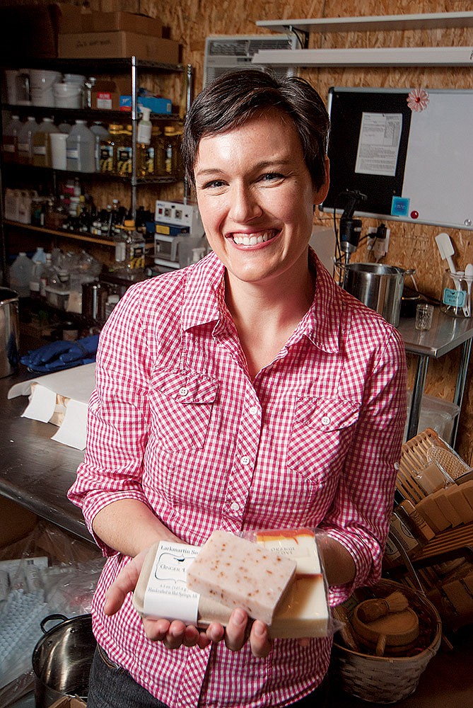 Briana Moore, one of the partners who will be operating the Hale Handmade Shop at the Hale Bath House in Hot Springs, shows some of her handcrafted soaps that will be among the products by local artisans displayed at the 122-year-old bathhouse for the holiday season and perhaps longer.