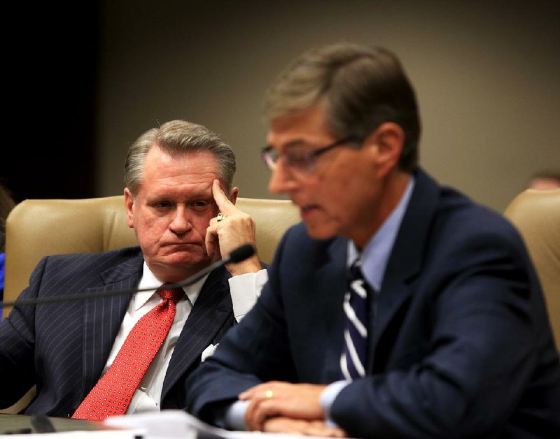 Former University of Arkansas at Fayetteville spokesman John Diamond (right) alleges under oath Friday before the Legislative Joint Auditing Committee that UA Chancellor G. David Gearhart (left) ordered employees of the university’s fundraising unit to destroy budget documents. 