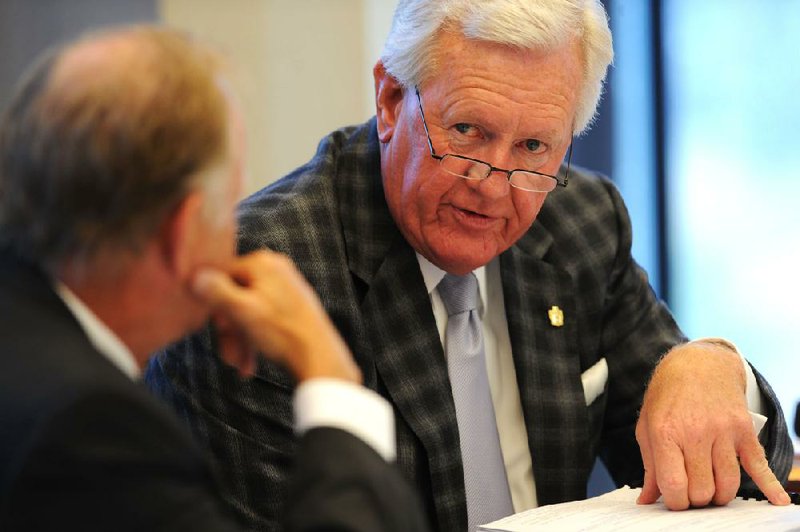 NWA Media/ANDY SHUPE - Ben Hyneman, vice secretary of he University of Arkansas Board of Trustees, right, speaks as Jim von Gremp, vice chairman, listens during a meeting of the board Friday, Sept. 13, 2013, in Willard J. Walker Hall on the university campus in Fayetteville.