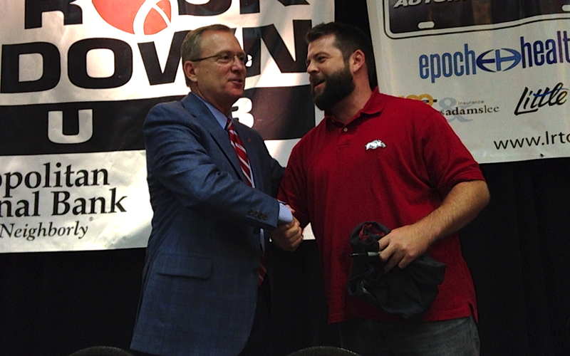 Arkansas Athletic Director Jeff Long greets a fan Monday following his address at the Little Rock Touchdown Club. 