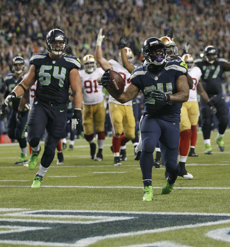 Seattle Seahawks' Marshawn Lynch (24) runs for a touchdown against the San Francisco 49ers in the second half of an NFL football game, Sunday, Sept. 15, 2013, in Seattle. (AP Photo/John Froschauer)