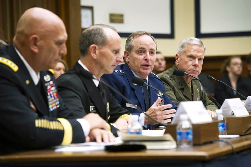 Testifying Wednesday before the House Armed Services Committee about the military budget, Army Chief of Staff Ray Odierno (from left), Chief of Naval Operations Admiral Jonathan Greenert, Air Force Chief of Staff Gen. Mark Welsh and Marine Corps Commandant Gen. James Amos discuss cuts their branches of the military are facing.