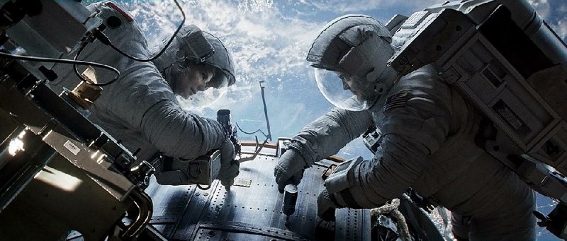 Sandra Bullock and George Clooney face a harrowing adventure in space in Gravity. 