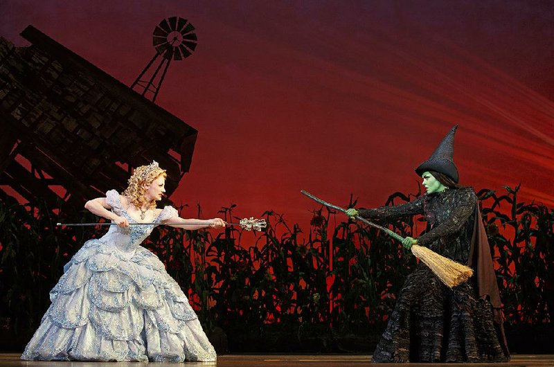 FILE — Glinda (Hayley Podschun, left) and Elphaba (Jennifer DiNoia) square off, wand against broom, in the touring company of Wicked, in this 2013 file photo.