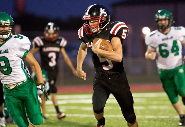 Shane Ivy of Pea Ridge on his way into the endzone for his first touchdown of three in the first quarterduring first home game at the new Blackhawks Stadium on September 20, 2013.