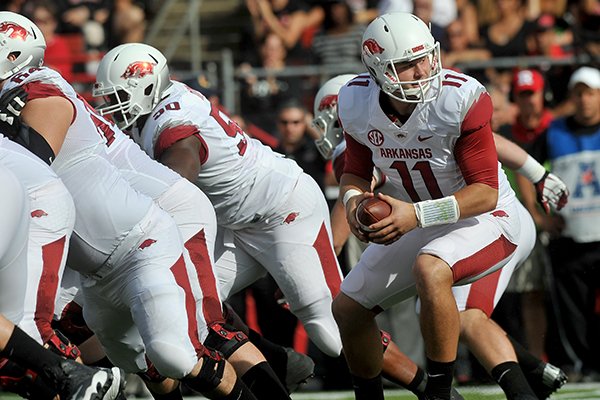 Arkansas quarterback AJ Derby takes the snap in the 2nd quarter of Saturday's game against the Rutgers at High Point Solutions Stadium in Piscataway, N.J. 