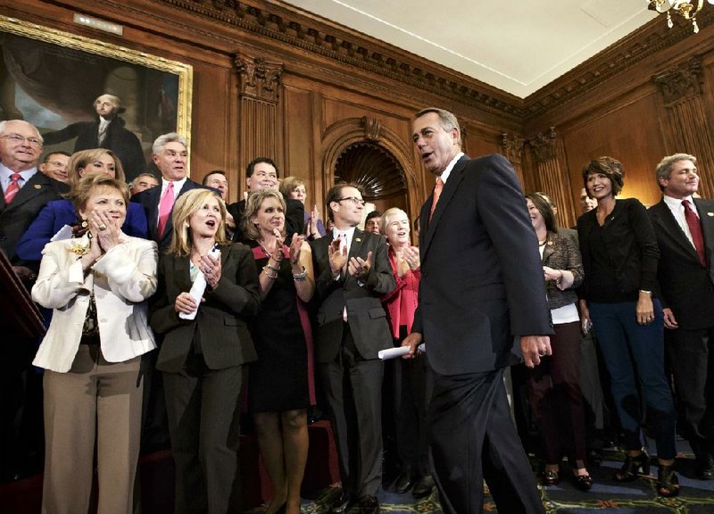 House Speaker John Boehner is cheered by fellow GOP House members Friday at the Capitol in Washington. “The House has listened to the American people,” he said. “Now it’s time for the United States Senate to listen to them as well.” 