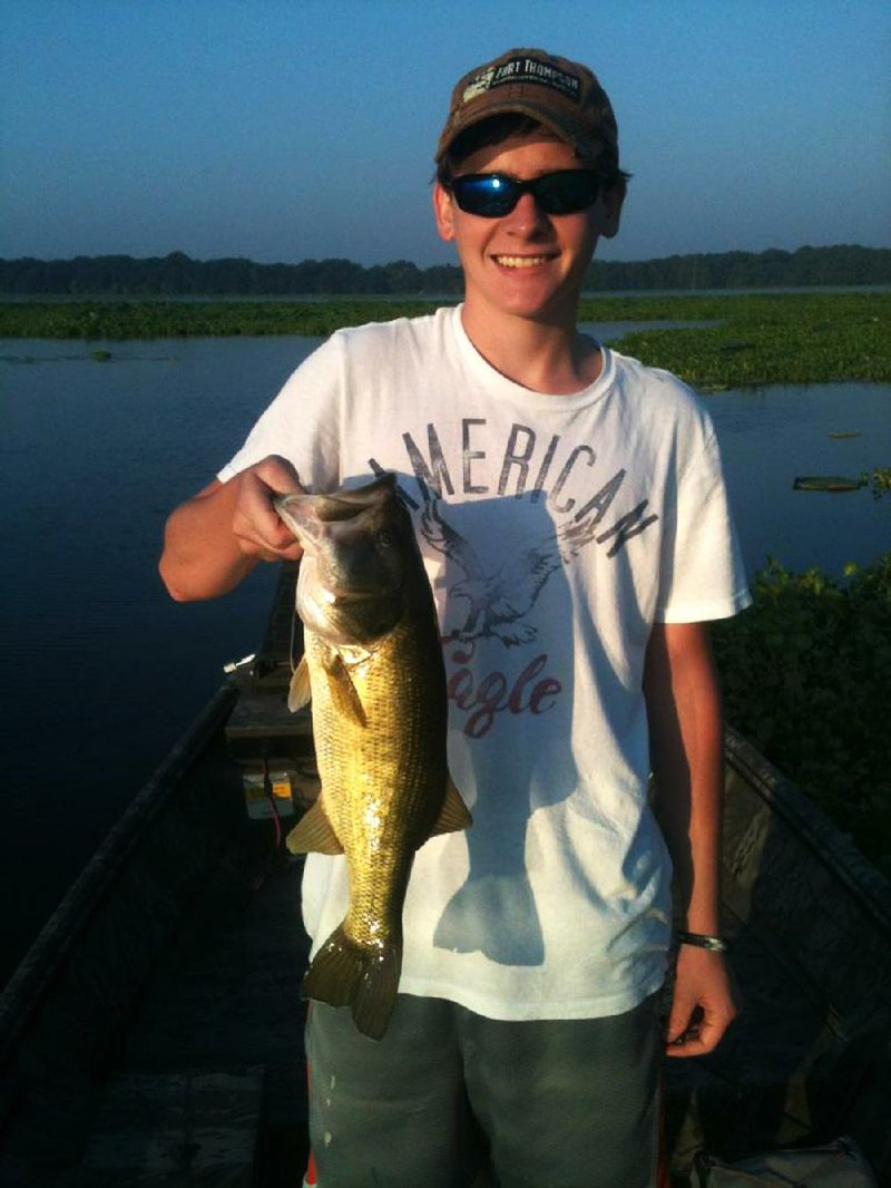 Carson Griffis of Lonoke has been catching bass like this in Post Lake with Tim Griffis, his dad, but bites were scarce last week. 
