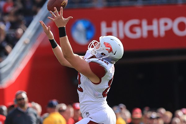 Arkansas's Alan D'Appollonio catches a pass for a first down on a fake punt during a game Saturday at High Points Solutions Stadium in Pisctaway, N.J.