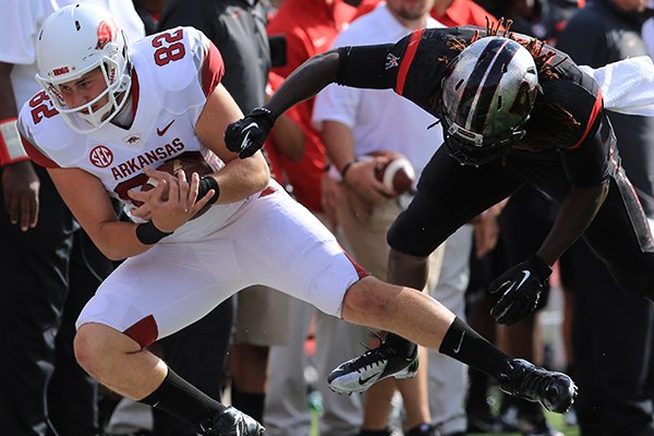 Arkansas' Alan D'Appollonio is tackled after he caught a pass for a first down on a fake punt during a game against Rutgers on Saturday, Sept. 21, 2013 at High Points Solutions Stadium in Pisctaway, N.J.