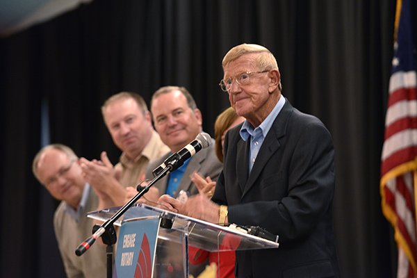 Former Arkansas/Notre Dame coach Lou Holtz waits for the applause to die down while serving as the guest speaker Monday Sept. 23, 2013 at the Springdale RotaryClub and NWA Touchdown Club luncheon at the Springdale Holiday Inn in Springdale. Holtz told stories from his coaching and broadcasting careers and some of the his opinions on the sport today.