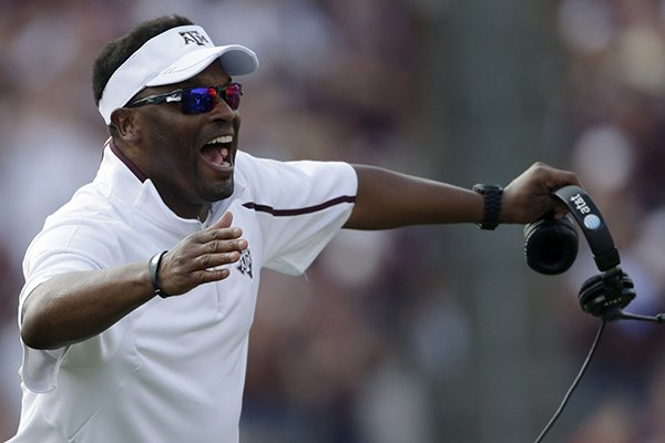 Texas A&M head coach Kevin Sumlin celebrates after a touchdown against Alabama during the fourth quarter of an NCAA college football game Saturday, Sept. 14, 2013, in College Station, Texas. (AP Photo/David J. Phillip)