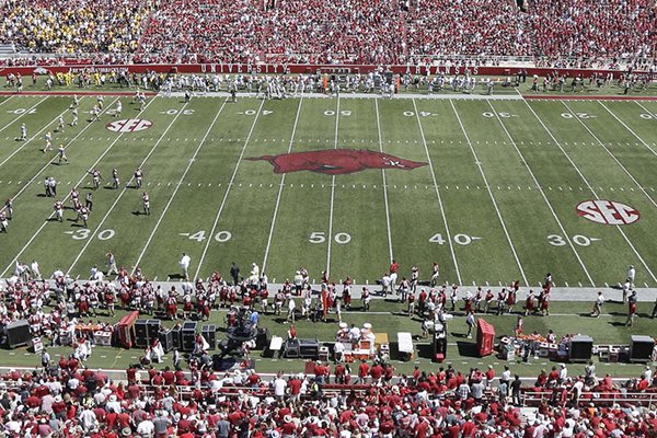 Fans watch the second half of an NCAA college football game between Arkansas and Southern Mississippi at Reynolds Razorback Stadium in Fayetteville, Ark., Saturday, Sept. 14, 2013. (AP Photo/Danny Johnston)