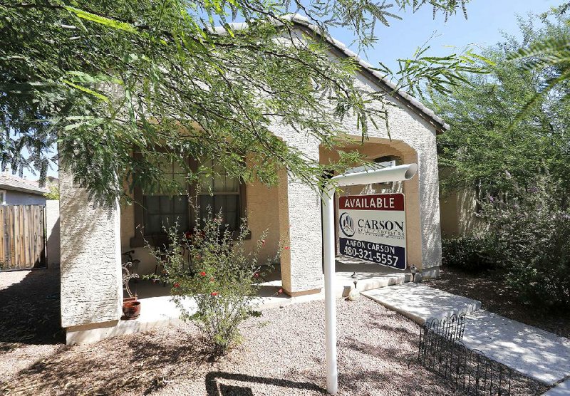 A home in Gilbert, Ariz., awaits a buyer in late July. For the month, home prices rose 12.4 percent compared with July 2012, according to an index released Tuesday. 