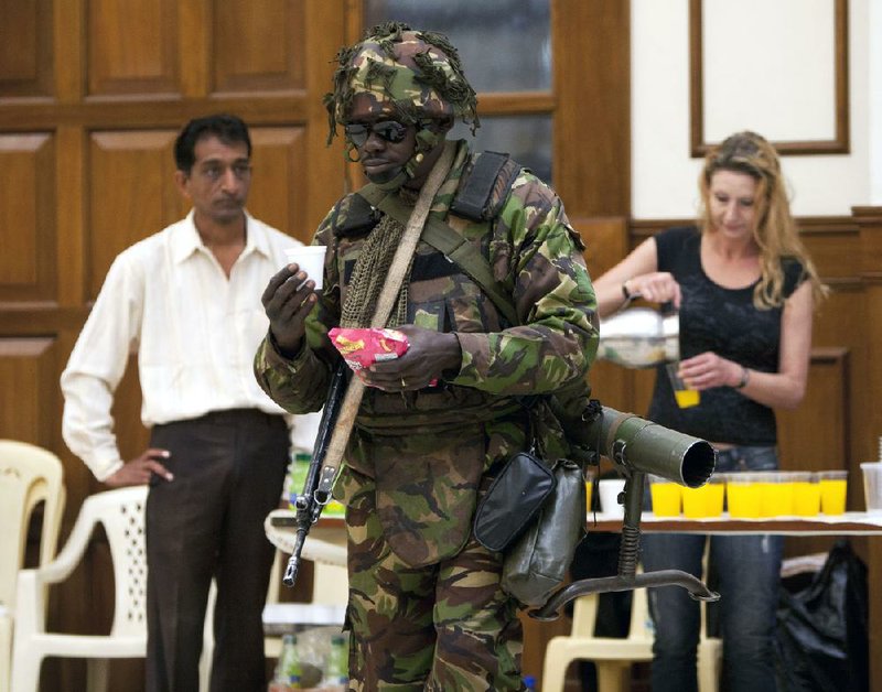 Relatives of Johnny Mutinda Musango, 48, weep Tuesday after identifying his body at the city morgue in Nairobi, Kenya. Musango was one of the victims of the terrorist attack on Westgate Mall. Kenyan security forces were still combing the mall on the fourth day of the turmoil at the mall. 