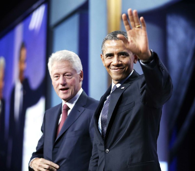 President Barack Obama waves to members of the audience after speaking Tuesday at the Clinton Global Initiative with former President Bill Clinton in New York. 