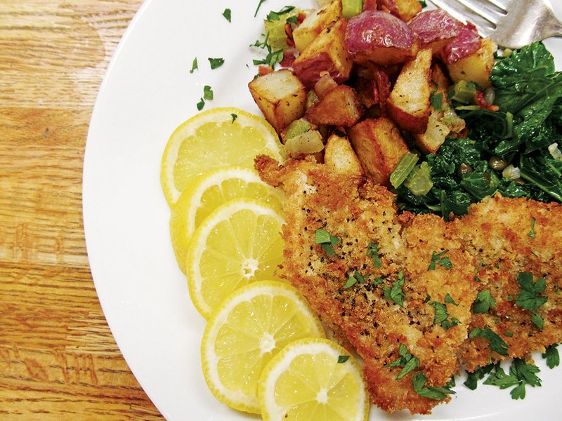 Wiener schnitzel, a misnomer in English, actually has no wieners but is lightly breaded and fried veal (or chicken or pork) pounded thin and served with lemon. Adding kale with shallots and capers, rounded out by a somewhat familiar warm potato salad, is a great way for the family to celebrate Oktoberfest. 