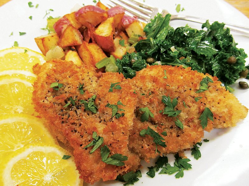 Wiener schnitzel, a misnomer in English, actually has no wieners but is lightly breaded and fried veal (or chicken or pork) pounded thin and served with lemon. Adding kale with shallots and capers, rounded out by a somewhat familiar warm potato salad, is a great way for the family to celebrate Oktoberfest.