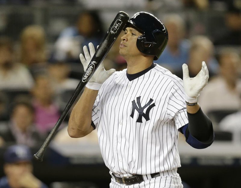 New York Yankees infielder Alex Rodriguez heads to the bench after a fifth-inning strikeout — one of his two in the game — in a 8-3 loss to Tampa Bay on Wednesday. The loss eliminated the Yankees from the playoffs for only the second time in 19 seasons. 