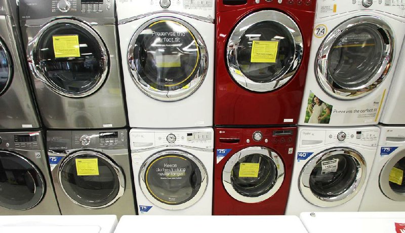 Front-load washing machines are displayed at a Sears store in Berlin, Vt., last week. Companies placed slightly more orders in August for U.S.-made durable goods, the Commerce Department said Wednesday. 