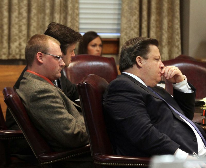 Former Little Rock police officer Josh Hastings (left) and his attorneys Rob Berry and Bill James (right) listen to closing arguments in Circuit Judge Wendell Griffen’s courtroom Wednesday during Hastings’ manslaughter trial at the Pulaski County Courthouse. Hastings is being retried for the August 2012 slaying of 15-year-old Bobby Joe “Weedy” Moore III after his first trial ended in a hung jury in June. 