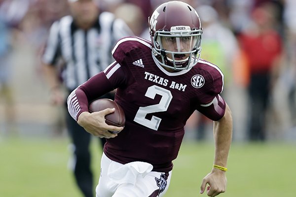 Texas A&M's Johnny Manziel (2) scrambles for yards during the third quarter of an NCAA college football game against Rice, Saturday, Aug. 31, 2013, in College Station, Texas. (AP Photo/Eric Gay)