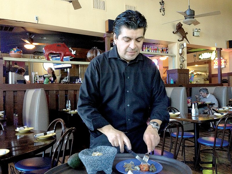 Guacamole is made tableside at Fonda Mexican Cuisine & Tequila Bar in Little Rock. 