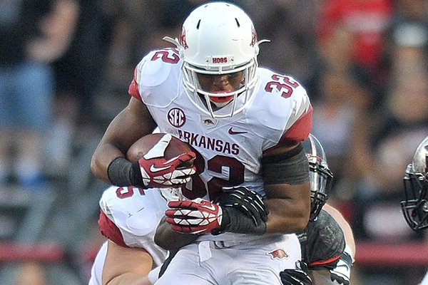 Arkansas running back Jonathan Williams tries to shake a Rutgers defender during the Razorbacks' game against the Scarlet Knights at High Point Solutions Stadium in Piscataway, N.J. 