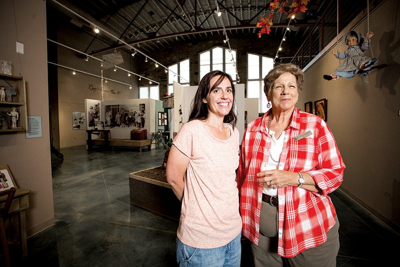 Amanda Nikkel, humanities educator, left, and Sherry Matthews, a volunteer, stand in front of the main gallery at the Old Independence Regional Museum in Batesville.
