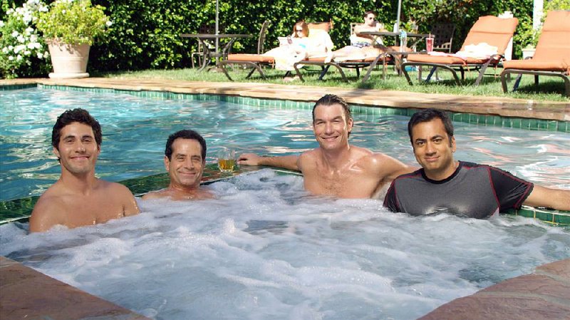 The new CBS comedy We Are Men stars (from left) Chris Smith, Tony Shalhoub, Jerry O’Connell and Kal Penn. The series debuts at 7:30 p.m. Monday. 