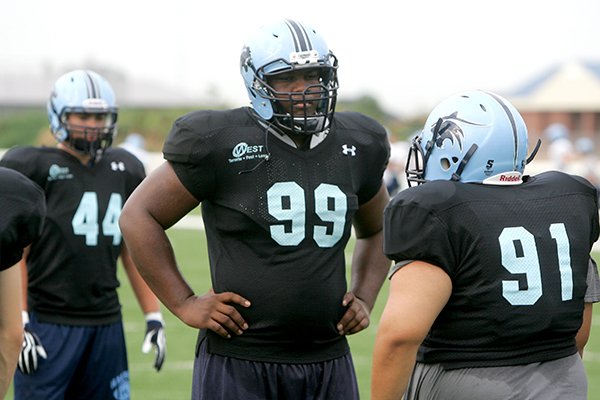 Har-Ber defensive tackle Josh Frazier works out during a 2013 preseason practice. 