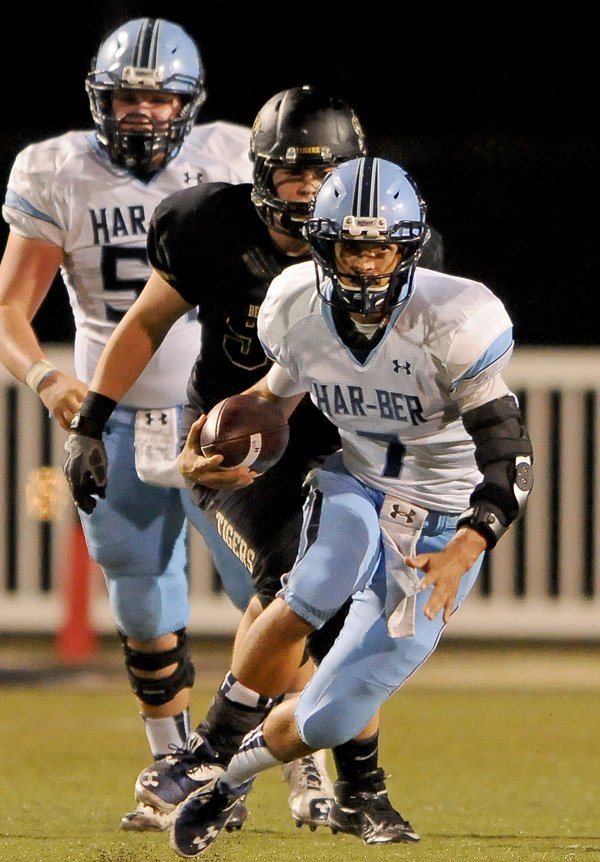 Springdale Har-Ber quarterback Kyle Pianalto runs the ball during the second quarter of the game against Bentonville in Tiger Stadium on Friday September 27, 2013.