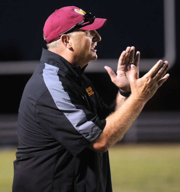 Jeff Bowerman, head coach of Lakeside Junior High School, yells from the sidelines Thursday, Sept 5, 2013, during the game against George Junior High School at Southwest Junior High School in Springdale. The game was the first for Lakeside.