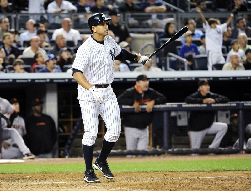 New York Yankees' Alex Rodriguez watches his grand slam during the seventh inning of an interleague baseball game against the San Francisco Giants, Friday, Sept. 20, 2013, at Yankee Stadium in New York. (AP Photo/Bill Kostroun)