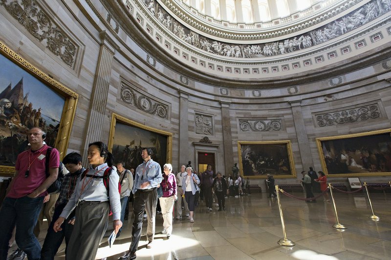 With hours to go until a possible government shutdown, visitors tour the Rotunda of the Capitol in Washington, Monday, Sept. 30, 2013. Capitol officials said today that if a shutdown goes into effect, all organized tours of the Capitol and the Capitol Visitors Center will be suspended. 
