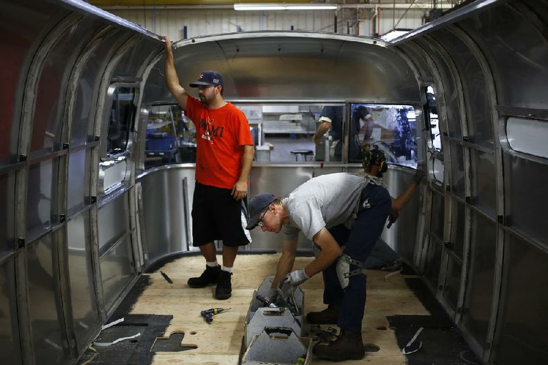Airstream Inc. workers assemble a recreational vehicle at the company’s plant in Jackson Center, Ohio, last month. U.S. manufacturers increased production in September, the Institute for Supply Management reported Tuesday. 