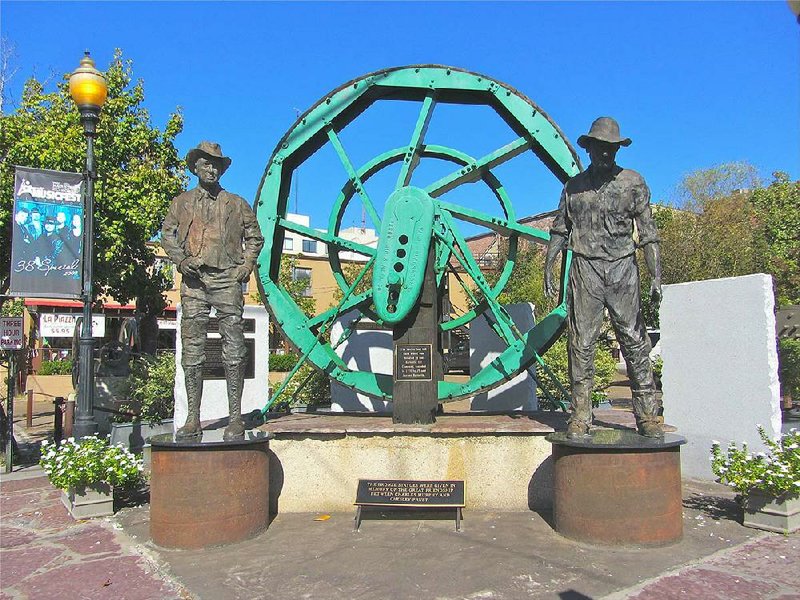 Oil Heritage Park in downtown El Dorado features a 12-foot-tall band wheel from the boom years of the 1920s. The sculpture honors the friendship between petroleum magnates Charles Murphy and Chesley Pruet. 