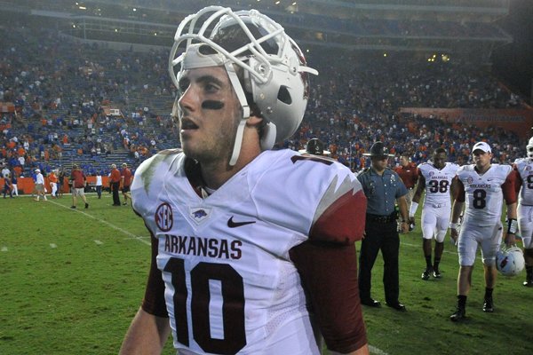 Arkansas quarterback Brandon Allen heads to the locker room following the Razorbacks' loss after Saturday night's game at Ben Hill Griffin Stadium in Gainesville, Florida.