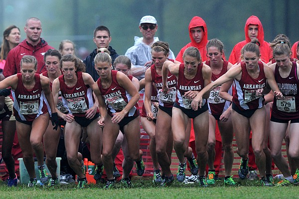 The Arkansas women's cross country team takes off at the start of the 25th annual Chile Pepper Cross County Festival Saturday, Oct. 5, 2013, at the University of Arkansas Cross County course located on the UA Agriculture Farm in Fayetteville. Lightning delayed the races by more than an hour and caused the 10K Open race to be cancelled.