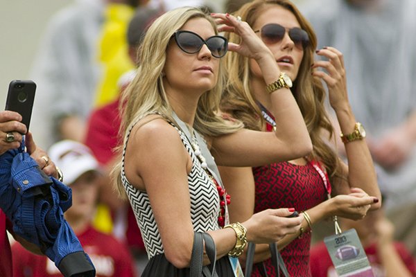 Jen Bielema, left, wife of Arkansas Razorback head coach Bret Bielema, stands on the sidelines before the start of an NCAA college football game against Texas A&M in Fayetteville, Ark., Saturday, Sept. 28, 2013. (AP Photo/Beth Hall)