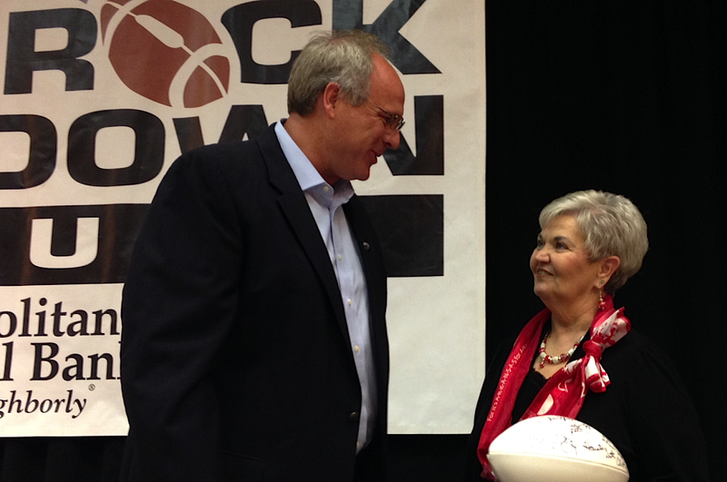 Central Arkansas coach Clint Conque speaks with a fan Monday afternoon after his address of the Little Rock Touchdown Club. 