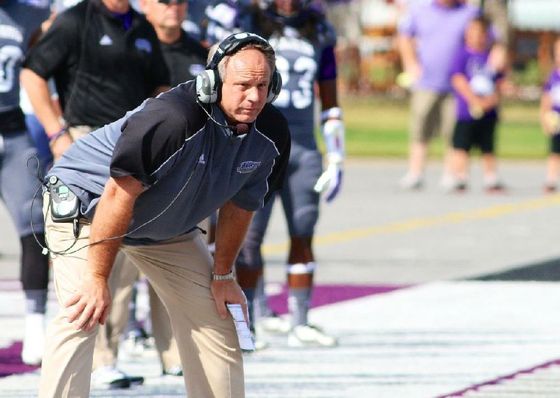 Special the the Arkansas Democrat Gazette/MATT JOHNSON - 10-5-2013 - UCA head coach Clint Conque watches his team during first-half action at Conway on October 5, 2013