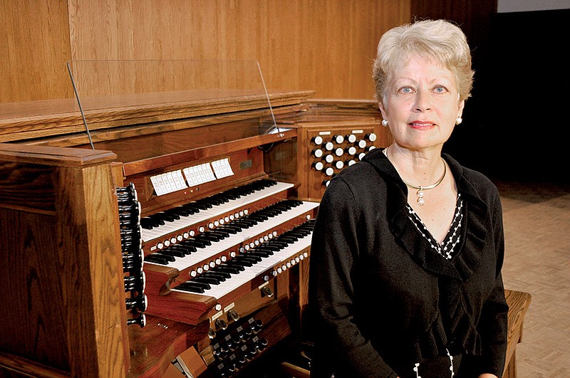 Ouida Keck, Ouachita Baptist University’s coordinator of keyboard studies, shows off the university’s custom-made organ in McBeth Recital Hall. Organist James David Christie will perform a free concert at 7:30 p.m. Tuesday celebrating the 25th anniversary of the first concert that featured the organ.