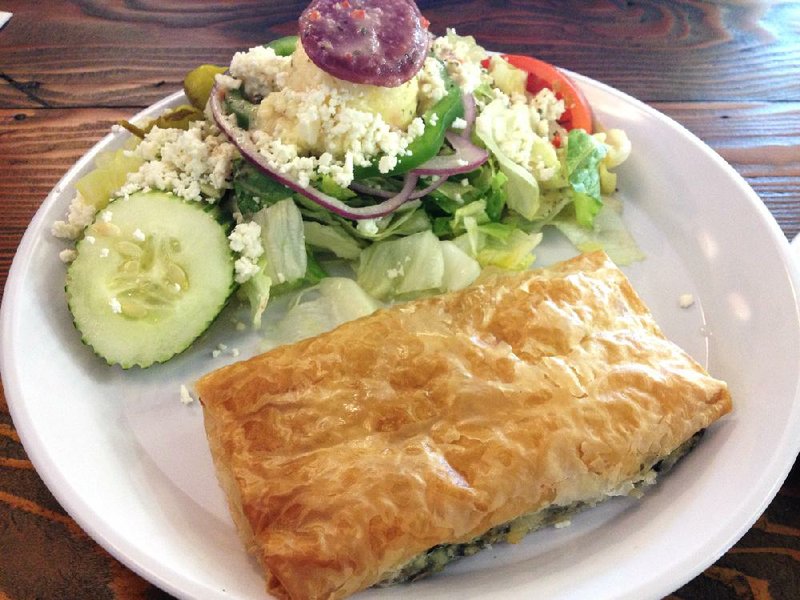 The Spinach Pie (Spanakopita) Platter includes a Greek salad at Little Greek Restaurant in Little Rock. 
