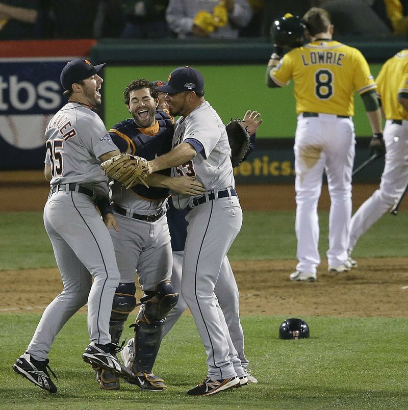 Detroit Tigers starter Justin Verlander (left) and closer Joaquin Benoit (right) celebrate with catcher Alex Avila after the Tigers defeated the Oakland Athletics 3-0 on Thursday to win the American League Division Series. Detroit will face Boston in the American League Championship Series beginning Saturday. 