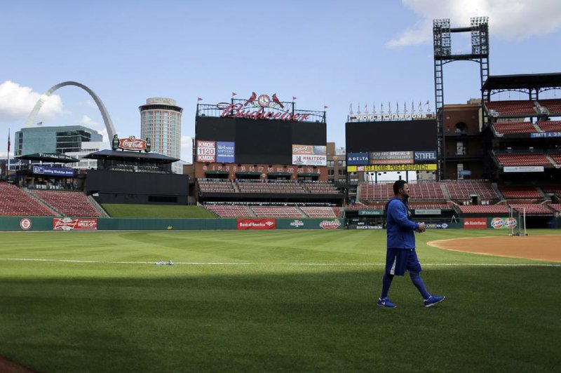 Los Angeles pitcher Ricky Nolasco walks onto the field before the start of Thursday’s practice at Busch Stadium in St. Louis, where the Dodgers will face the St. Louis Cardinals in the National League Championship Series that begins today. The two teams last faced each other in the National League Championship Series in 1985. 