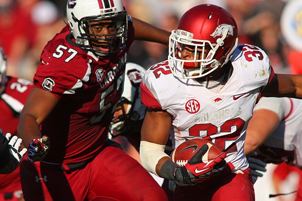 South Carolina's Aldrick Fordham, left, pursues Arkansas' Jonathan Williams in the the fourth quarter during their 2012 game in South Carolina. 