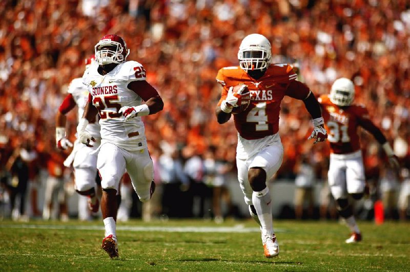 Texas' Daje Johnson (4)  runs the ball down the field for a touchdown during their 36-20 win over Oklahoma in an NCAA college football game at the Cotton Bowl Saturday, Oct. 12, 2013, in Dallas. (AP Photo/The Daily Texan, Chelsea Purgahn)