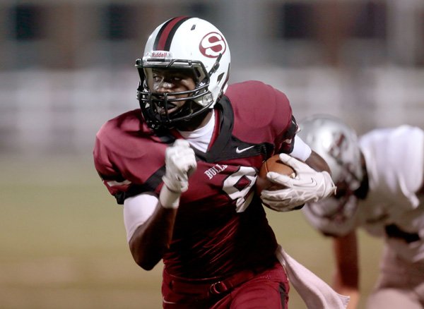 Springdale junior Zach Burton turns upfield after making a reception against Siloam Springs during the first half on Friday, Oct. 11, 2013, at Bulldog Stadium in Springdale.